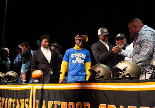 Players shake hands after the ceremony